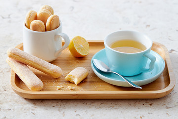 Sponge finger biscuits served with a cup of tea