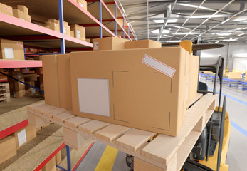 Cardbox mock up in a warehouse - 3d rendering - obrazy, fototapety, plakaty