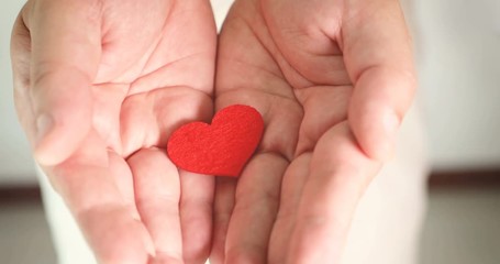 A man holding and giving  heart shape , love romance , take care health and family , Love giving of Happy Valentine's Day or anniversary concept , 4K Dci resolution