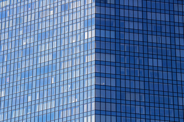 Fototapeta na wymiar Walls of glass-covered buildings