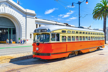 Naklejka na ściany i meble Famous city trams in San Francisco.