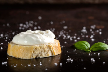 One slice of bread with cream sauce and salt