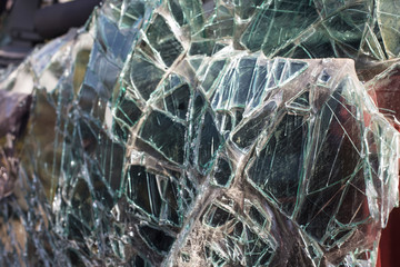 Broken front window of car in traffic accident. After the car crash, broken windshield