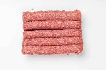 Pack of  raw sausages isolated on white