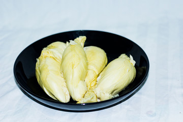 Durian that has been carved on a white background