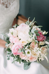 The bride is in an expensive dark Studio Suite. Wedding in the European style fine art.