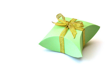 Isolated apple-green paper gift box for jewelry with golden satin ribbons bows on white background with copy space