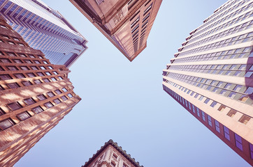 Looking up at New York buildings, color toned picture, USA.