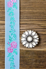 vintage aqua color tape with embroidered ornaments and old button
