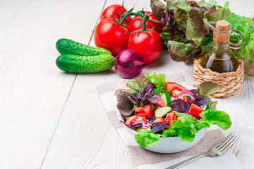 Healthy vegetable salad of fresh tomato, cucumber in bowl. Diet menu.