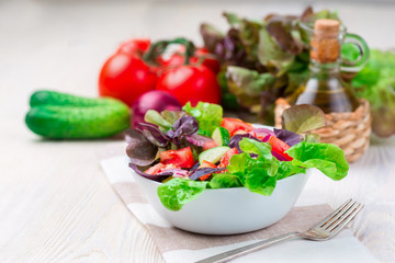 Healthy vegetable salad of fresh tomato, cucumber in bowl. Diet menu.