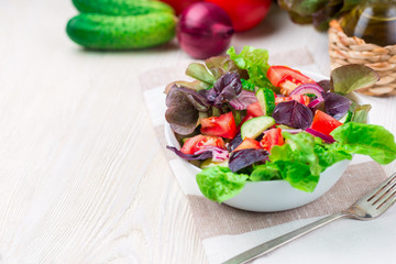 Healthy vegetable salad of fresh tomato, cucumber in bowl. Diet menu.
