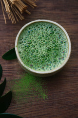 matcha green tea in a bowl on a dark background