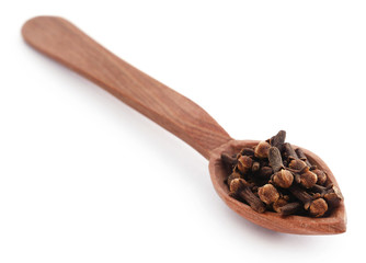 Organic clove in wooden scoop