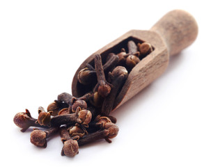 Organic clove in wooden scoop