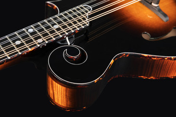 Fototapeta premium Mandolin isolated on black background. Music concept.