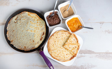 delicious pancakes with chocolate sugar and jam