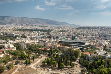 View of Athens cityscape through ancient stone theatre, Greece