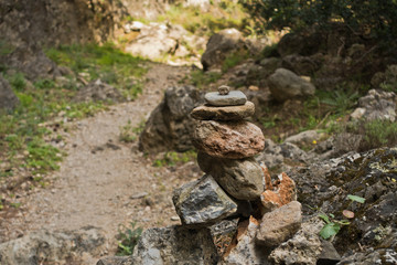 Trail marker on a winding path through Lissos gorge near Sougia, south-west coast of Crete island, Greece