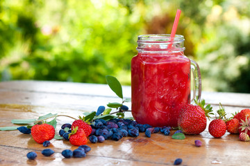 Strawberry smoothie in the glass jar. Summer,  healthy organic food concept.