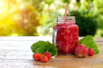 Strawberry smoothie in the glass jar. Summer,  healthy organic food concept.