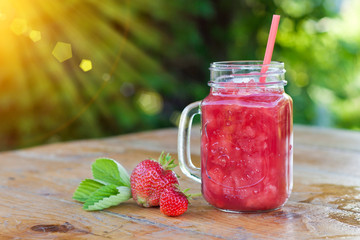 Strawberry smoothie in the glass jar. Summer,  healthy organic food concept.