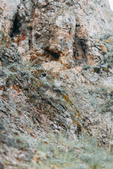 The bends of the river and the beautiful cliffs. Summer nature and texture of the stones with streaks.