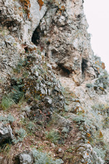 The bends of the river and the beautiful cliffs. Summer nature and texture of the stones with streaks.