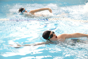  boys swimming  in pool © yanlev