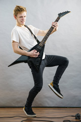 Fototapeta premium Man playing on electric guitar