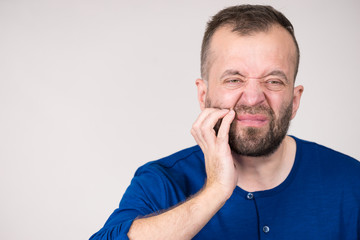 Obraz premium Man having tooth pain
