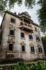 Fototapeta na wymiar Jul 2017 – Kaiping, China - Linlu Villa in Kaiping Diaolou Maxianglong village, near Guangzhou. Built by rich overseas Chinese, these family houses are a unique mix of Chinese and western architecture