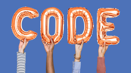 Hands holding code word in balloon letters
