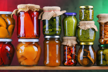 Jars with variety of pickled vegetables and fruits