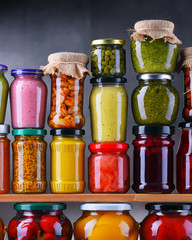 Jars with variety of pickled vegetables and fruits