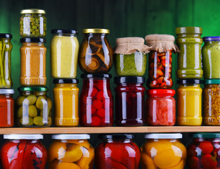 Jars with variety of pickled vegetables and fruits