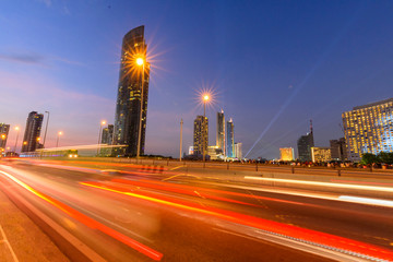 Fototapeta premium blur light of car traffic and sky train in city