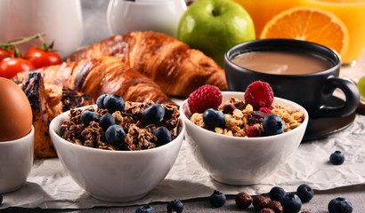 Breakfast served with coffee, juice, croissants and fruits