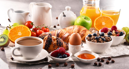 Breakfast served with coffee, juice, croissants and fruits