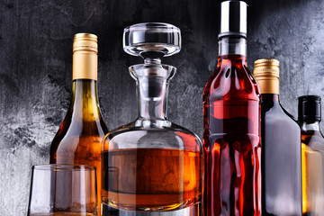 Carafe and bottles of assorted alcoholic beverages.
