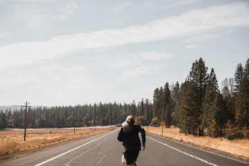 Fototapeta premium Man jogging on a countryside road