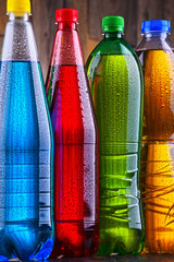 Plastic bottles of assorted carbonated soft drinks