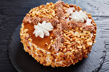 peanut cake topped with cream, close up