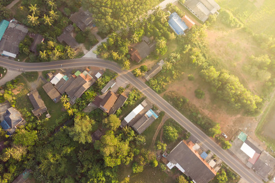 Road And Small Town At Sunrise Aerial View