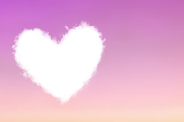 Cloud heart fly in violet pink sky.