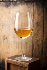 White wine near a barrel