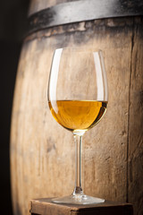 White wine near a barrel
