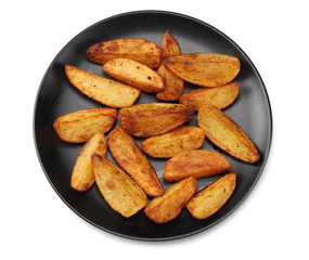 Fried potato wedges on black plate isolated on white background. top view. Fast food.