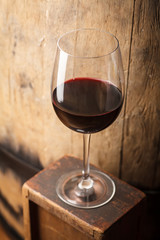 Red wine near a barrel