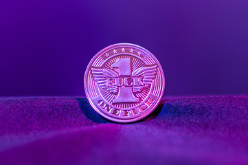 One fuck coin closeup